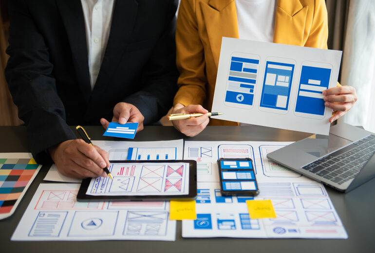 Team collaborating on website design wireframes